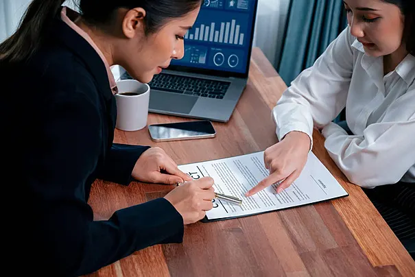Businessman at desk (partial image visible)